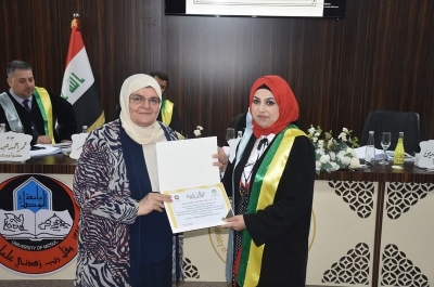 تدريسية من جامعة كركوك كلية  تشارك في مناقشة رسالة ماجستير في جامعة الموصل